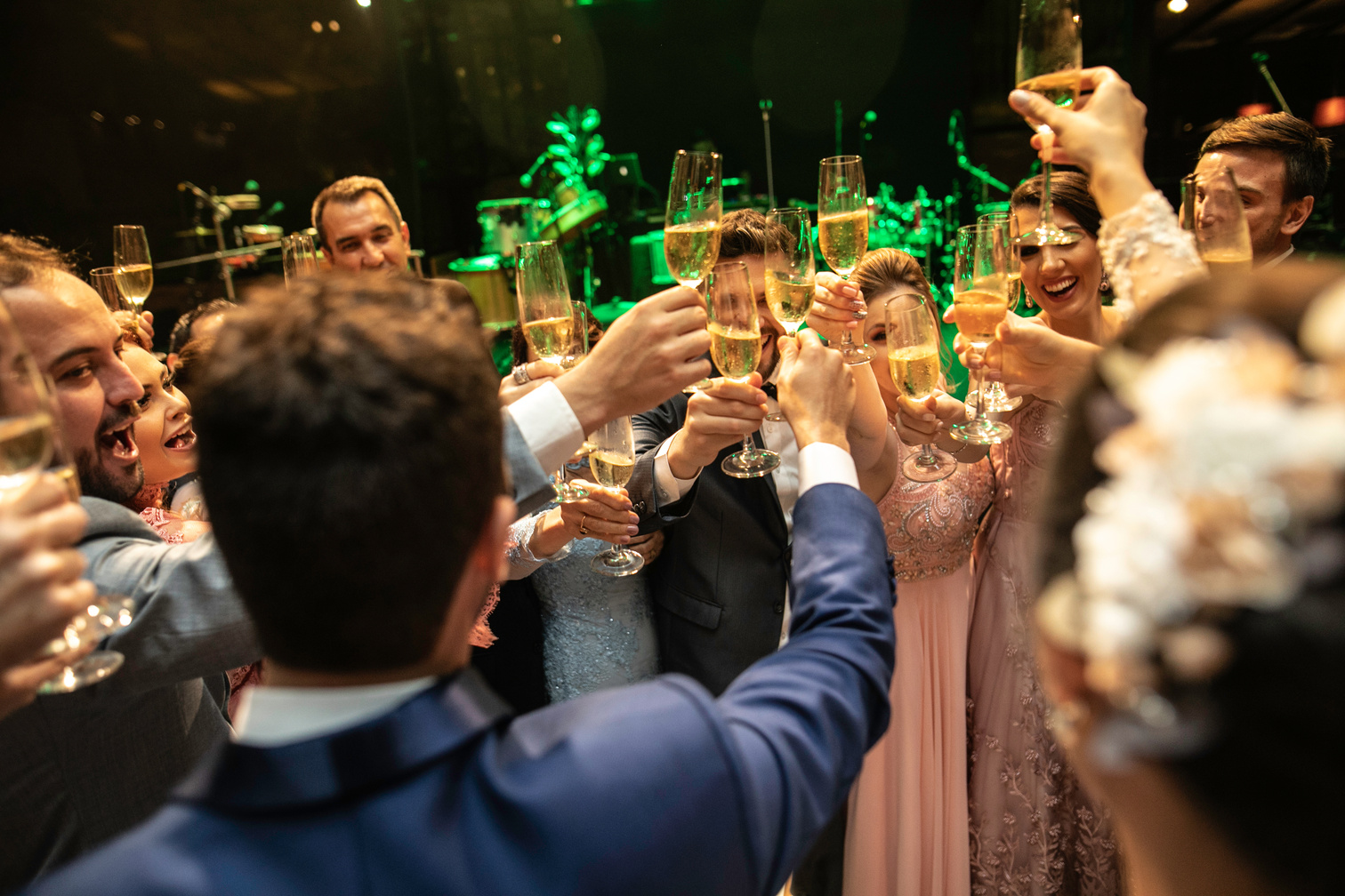 Bride, groom and wedding guests making a toast